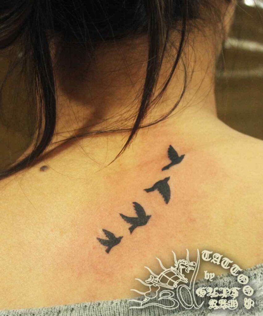 flying birds on neck , tattoo artist in manali, small tattoos